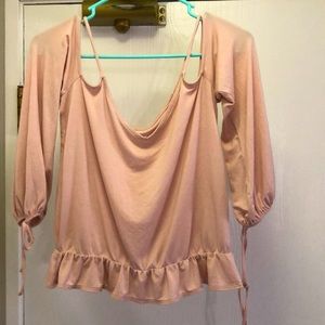 Off the shoulder long sleeve. Pretty light pink color. Size medium. Soft fabric.